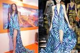 张梓琳身穿Louis Vuitton 2011春夏时装秀上的斑马纹高开叉深V礼服亮相戛纳，露出修长美腿。