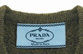 Miuccia Prada曾经在她的设计中更换新标签，定为：Miuccia Prada Made in系列。其中每件商品都附有“原产国”的标识，使消费者在购买的时候就知道这是在哪国制造和在哪里获取灵感。讽刺的是，这个系列中并没有中国系列
“Made in Peru”羊驼毛V-neck冷衫 
HK$5,950