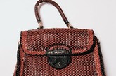 Miuccia Prada曾经在她的设计中更换新标签，定为：Miuccia Prada Made in系列。其中每件商品都附有“原产国”的标识，使消费者在购买的时候就知道这是在哪国制造和在哪里获取灵感。讽刺的是，这个系列中并没有中国系列
Prada “Made in India”手织皮手袋 
HK$19,950