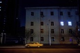 平壤市中心，一辆车在夜里孤独地驶过。