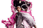 中国超模刘雯身穿John Galliano、Rodarte、Misson等一系列时装拍摄西班牙版《Vogue》2011年1月号。
夸张的民族风帽饰，宽大的裙摆演绎另类风情。